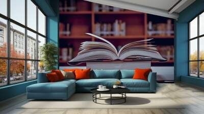 Stack of books in the library and blur bookshelf background Wall mural