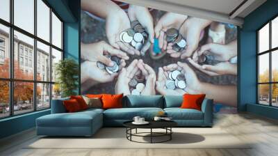 Group of children holding money in hands in the circle together as finance and charity concept Wall mural