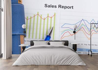 sheet of annual sales report with blue pen Wall mural