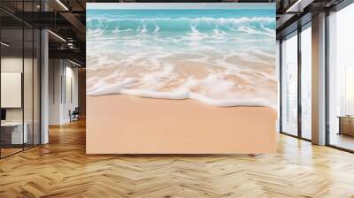 A close-up shot of gentle waves caressing the shore on a pristine sandy beach Wall mural