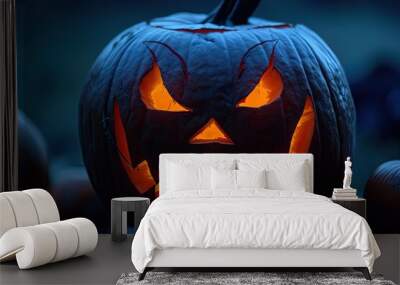 carved jack-o-lantern with a sinister grin and glowing eyes spooky halloween pumpkin jack o lantern  Wall mural