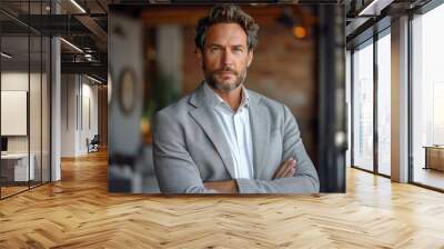 Handsome businessman standing in the office Wall mural