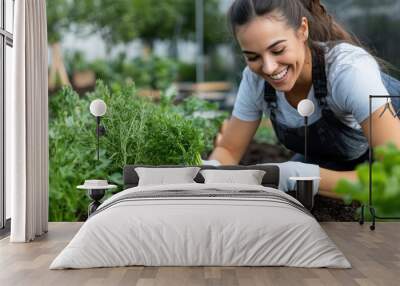 Smiling and enthusiastic gardener harvesting organic carrots in a lush green garden, epitomizing healthy living and joy of connecting with nature's bounty. Wall mural