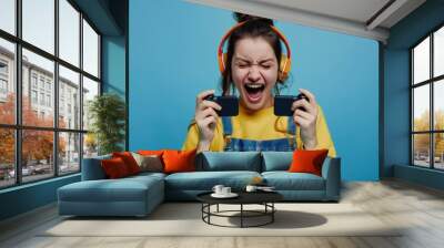 excited play games by mobile phone make winner gesture. winning mobile gambling. Wow face expression. Esport streaming game online, surprise, gamer, online, earning, new generation. Wall mural