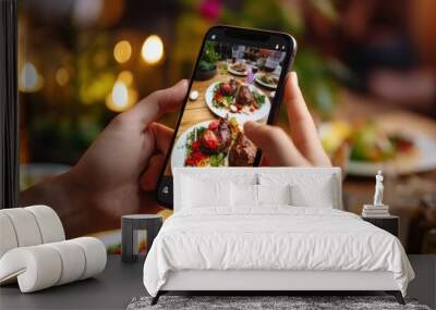 restaurant owner takes a picture of the food on the table with a smartphone to post on a website. Online food delivery, ordering service, influencer, review, social media, share, marketing, interest Wall mural