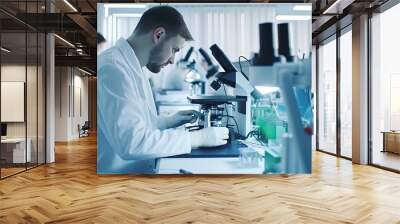 Scientist analyze biochemical samples in advanced scientific laboratory. Medical professional use microscope look microbiological developmental of viral. Biotechnology research in science lab... Wall mural