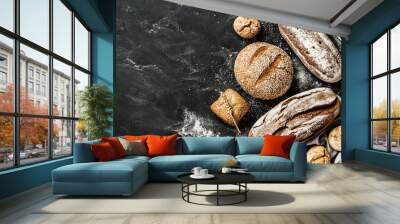 Bakery - rustic crusty loaves of bread and buns on black Wall mural