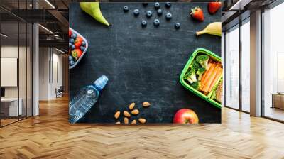 school lunch box with sandwich, vegetables, water and fruits Wall mural