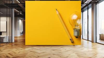 Business inspiration and creativity concept with lightbulb and pencil on yellow background, motivating success Wall mural