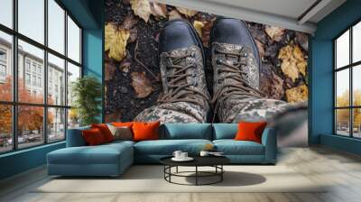 Durable Boots on Leafy Ground in Autumn Setting Wall mural