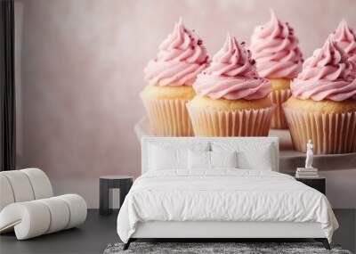 Pink frosted cupcakes on a cake stand, sweet dessert and birthday party celebration, cheerful and festive treats Wall mural