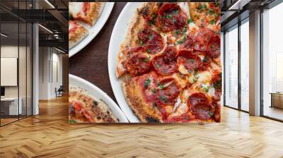 Horizontal banner or header Top view three delicious Italian pizzas on the table. Wall mural