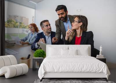 Business team working together on laptop in modern office Wall mural