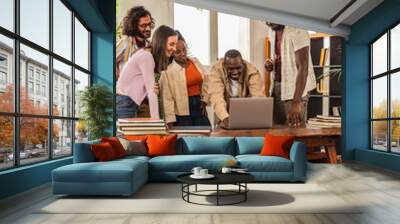 Multiracial adult students on campus with books and laptop Wall mural