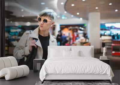 Businesswoman portrait at duty free airport. Wall mural