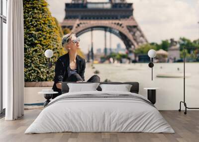 fashion young blonde woman portrait in front of the eiffel tower Wall mural