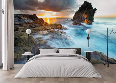 Beautiful sunrise at ocean coast Wall mural