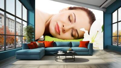 Beautiful woman lying on a towel. Spa concept. Wall mural