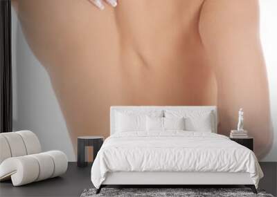 Nude woman with backache Wall mural