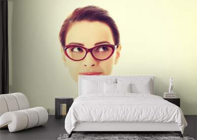 Portrait of beautiful woman in red eyeglasses. Wall mural