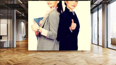 Smiling businesswomen with thumbs up. Wall mural