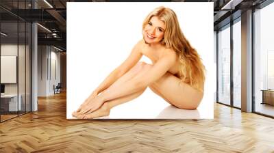 Spa woman sitting touching her feet Wall mural