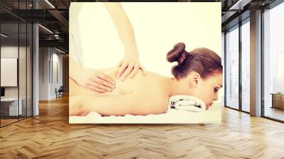 Woman relaxing beeing massaged in spa saloon Wall mural