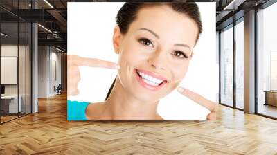 Woman showing her perfect  teeth. Wall mural