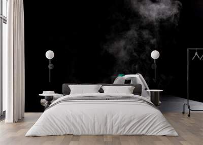 Steam rises from the iron on the white sheets. Accessories for small household chores. Wall mural