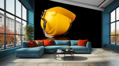 Yellow helmet on a dark workbench. Protection accessories for construction workers. Dark background. Wall mural