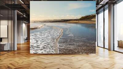 Hornsea Beach shot early on a sunny morning with the caravan park to the right and a low tide to the left. One of the cleaner UK beaches found in East Yorkshire Wall mural