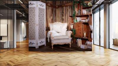 Wooden living room with beige chair and bookcase Wall mural