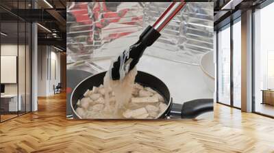 Noodles in a pot on the stove. Wall mural