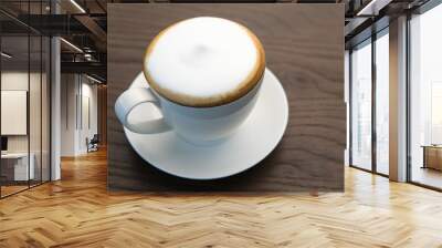 Hot cappuccino coffee on wood table. Wall mural