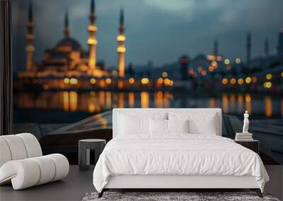 Blurred Night View of a Mosque with an Open Quran in the Foreground Wall mural