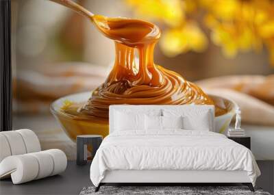 Dulce de leche, traditional sweet in Latin America.in white table and yellew background Wall mural