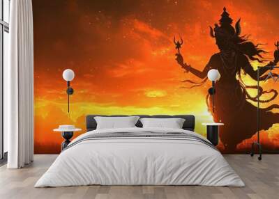 Silhouette of a Hindu Goddess with a Trident Against an Orange Sunset Wall mural