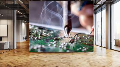 Technician repair electronic circuit board with soldering iron and tin wire Wall mural