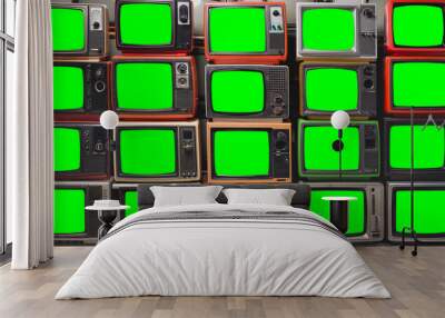 Twenty vintage televisions with chroma key green screen for designer. Pattern wall of pile old retro TVs Wall mural