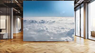 Cloud view through airplane window. Wall mural