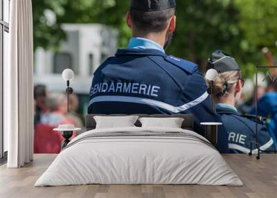 Brisach - France - 1 May 2018 - french gendarmerie patrol in lily of the valley party in the street Wall mural