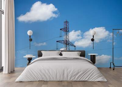 vuew of high voltage tower on blus cloudy sky background Wall mural