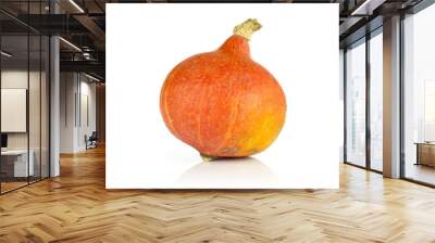 One whole bright fresh red kuri pumpkin hokkaido variety isolated on white background Wall mural