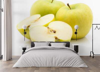 Two apple (Smeralda variety) halves and two whole isolated on white background green yellow. Wall mural