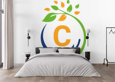 Charity logo with hand, leaf and C letter concept. Hand care foundation logo Wall mural