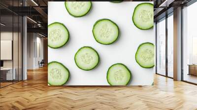 Freshly Cut Cucumber Slices Displayed on a Minimalistic White Background Wall mural