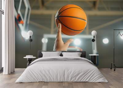 A close-up of a basketball player spinning a ball on their finger, with the hoop blurred in the background isolated with white highlights, png Wall mural