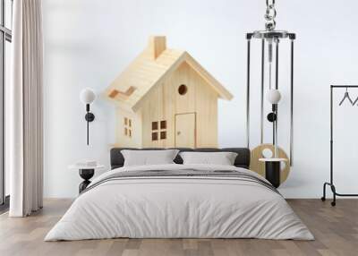 Wooden house model and key with prison pendulum, concept of borrowing debt to buy a house, family burdens, higher family expenses isolated with white highlights, png Wall mural