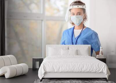 African-American female doctor wearing medical mask in clinic Wall mural