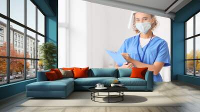 African-American female doctor wearing medical mask in clinic Wall mural